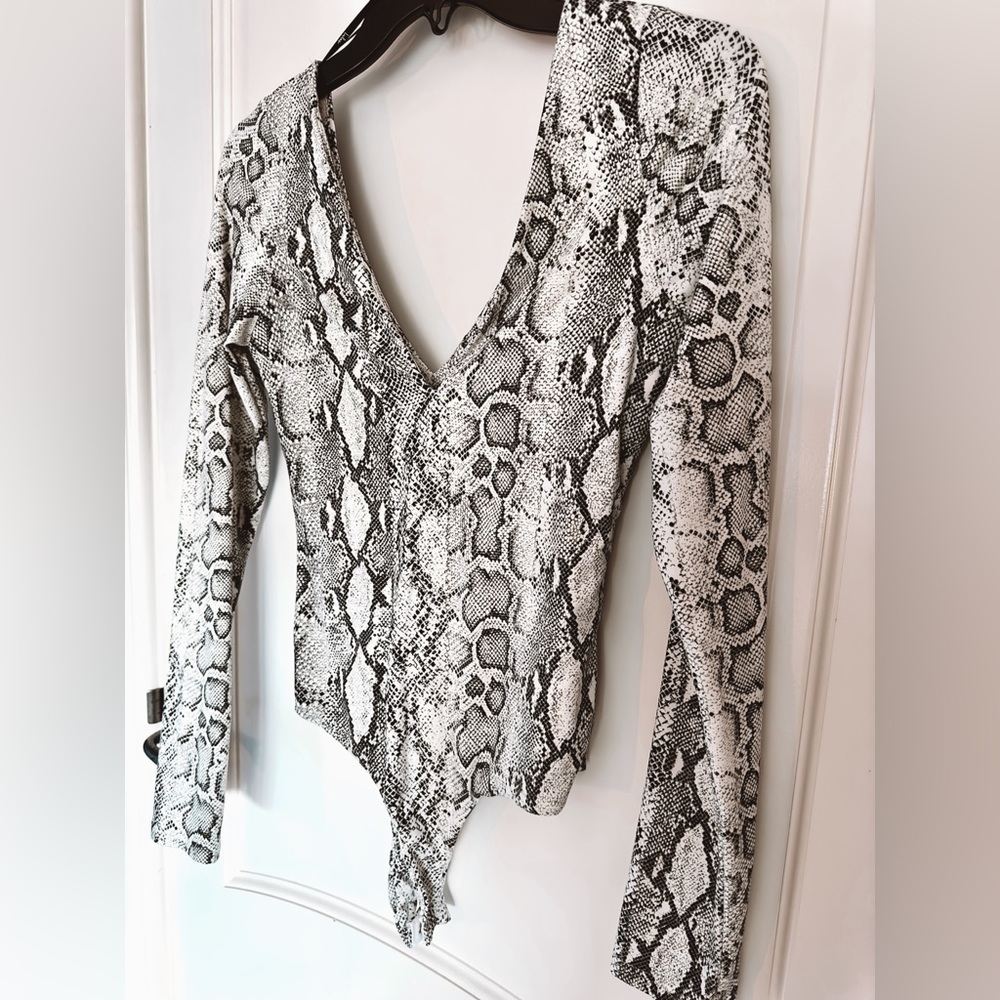 Black, white, and grey snake print long sleeve bodysuit.